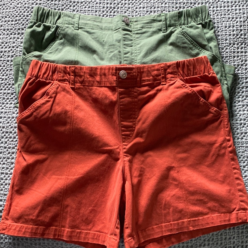 Two pull on shorts one green and one rust.